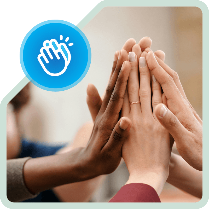 Group of diverse hands coming together for a high-five